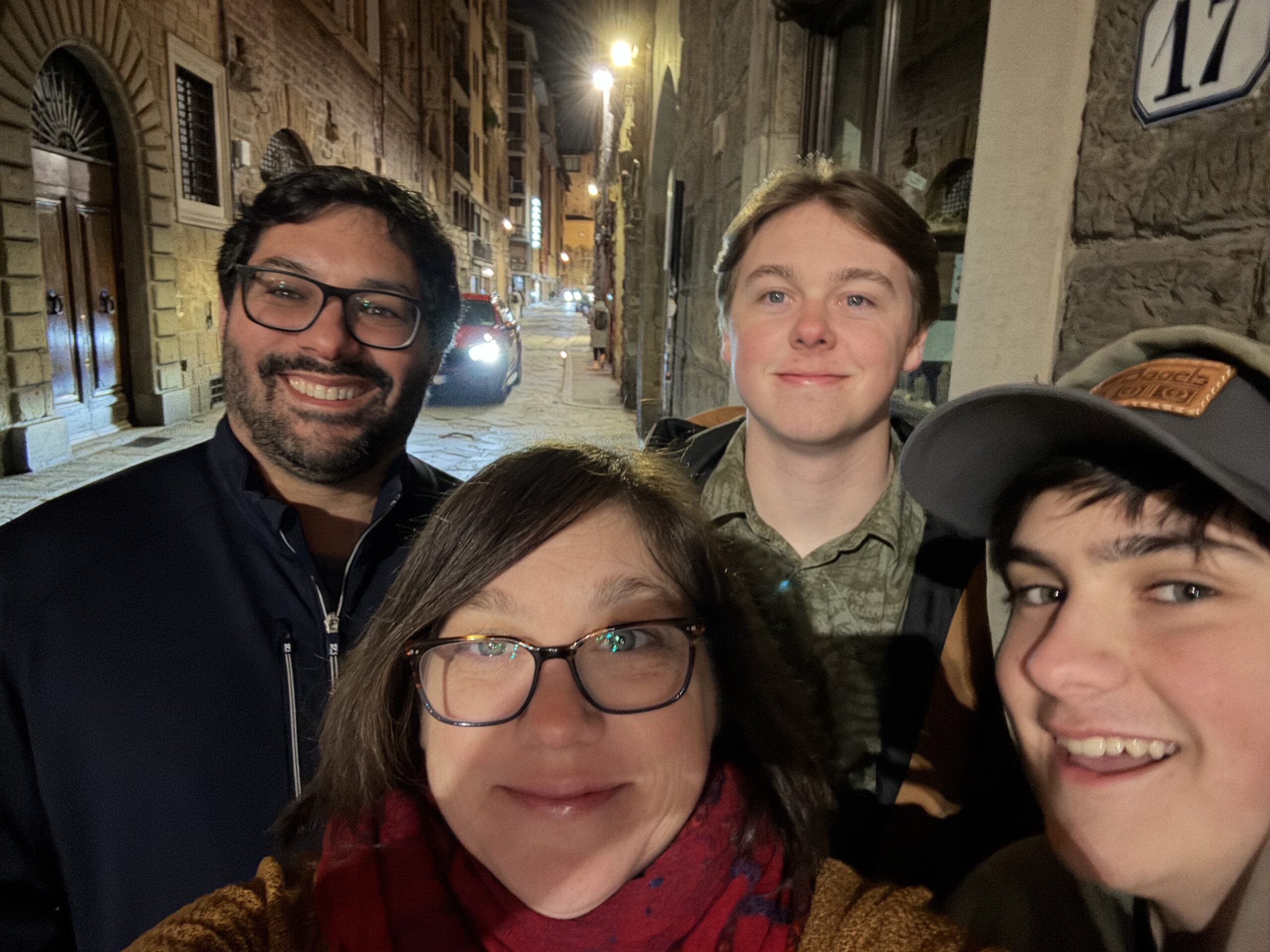 Kristie, her husband and teen age sons on Italian streets at night