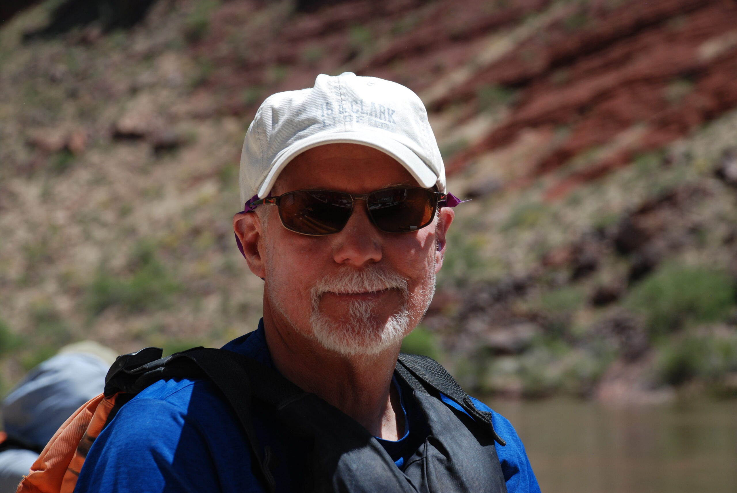 Man in a white hat and backpack
